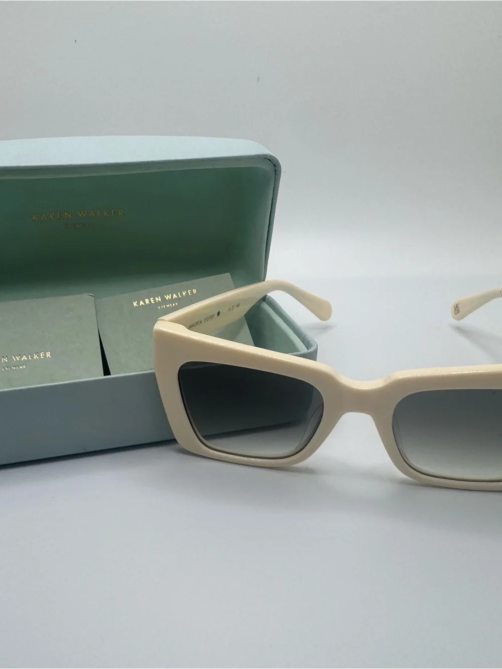 Karen Walker Cream Cat-Eye Sunglasses with Gray Gradient Lenses